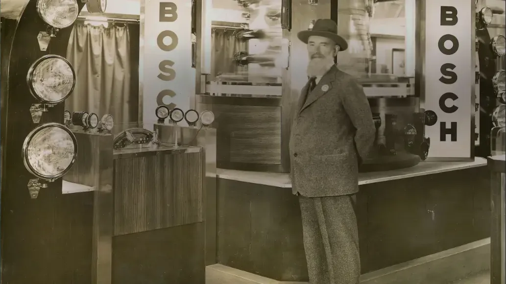 Robert Bosch posing in front of his store